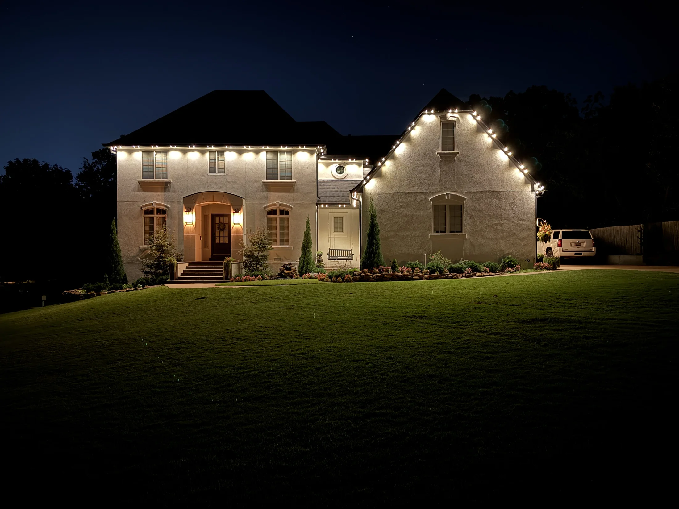 Jade Ridge permanent warm-white roofline lighting on a completed Central Illinois home